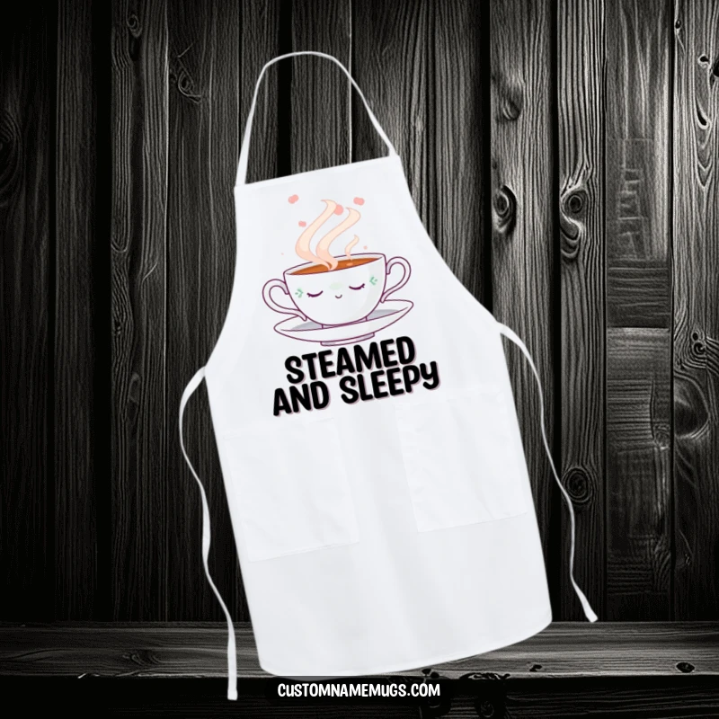 Funny Napping Teacup Apron: Kitchen apron featuring a cute napping teacup amidst a swirling steam cloud, perfect for a funny, relaxing cooking experience.