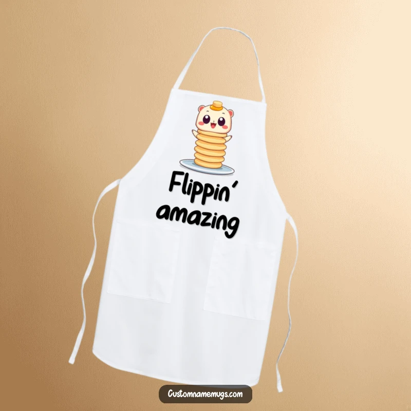 Funny kitchen apron showing a little creature with googly eyes balancing a huge stack of pancakes, ideal for joyful cooking.