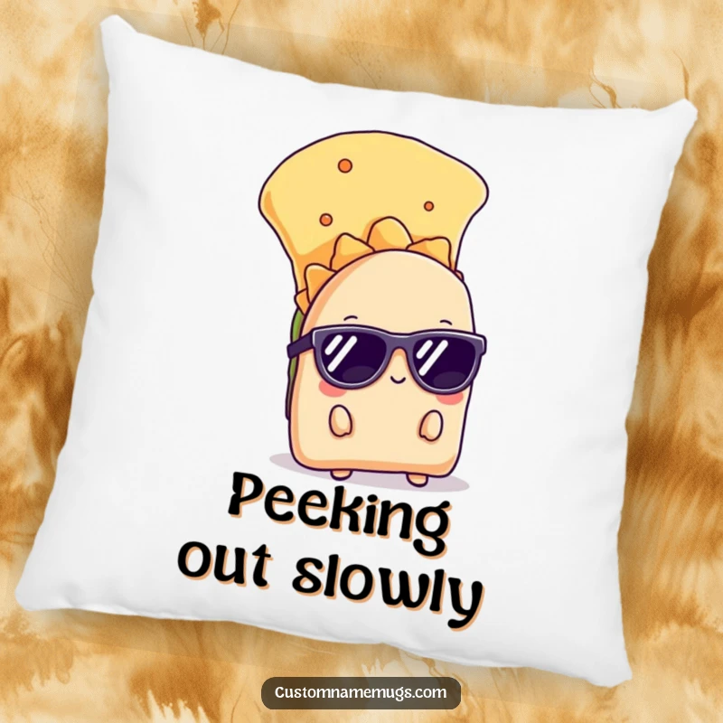 Funny pillow featuring a shy taco wearing sunglasses, peeking from behind a chip, providing cozy and humorous decor.