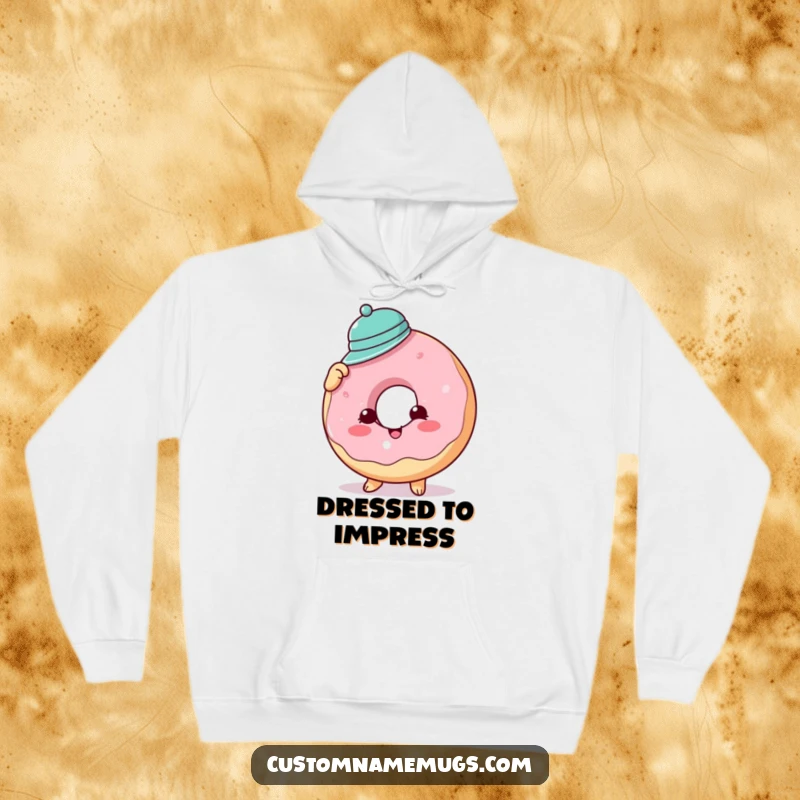 Funny donut hat hoodie showing a cheerful donut character struggling hilariously to wear a comically tiny hat, symbolizing fun fashion attempts.