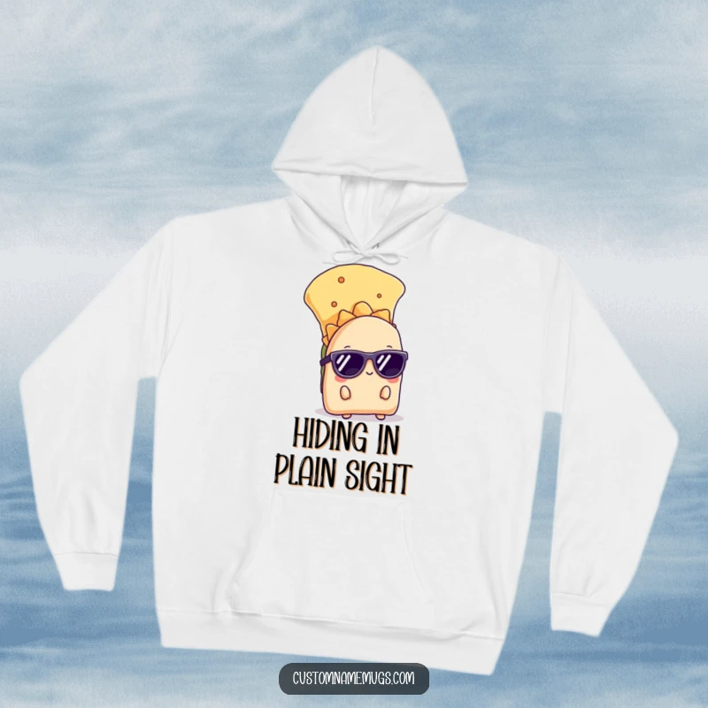 Funny hoodie featuring a shy taco with sunglasses peeking from behind a chip, offering warmth and humorous style.