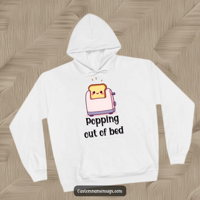 Soft, comfortable funny toast hoodie featuring a tiny smiling toast popping out of a toaster with surprise, for cozy mornings.