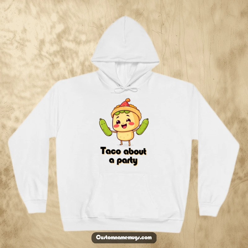 Funny Hoodie: A smiling taco character in a tiny party hat juggles three oversized pickles, depicting humorous fiesta energy.