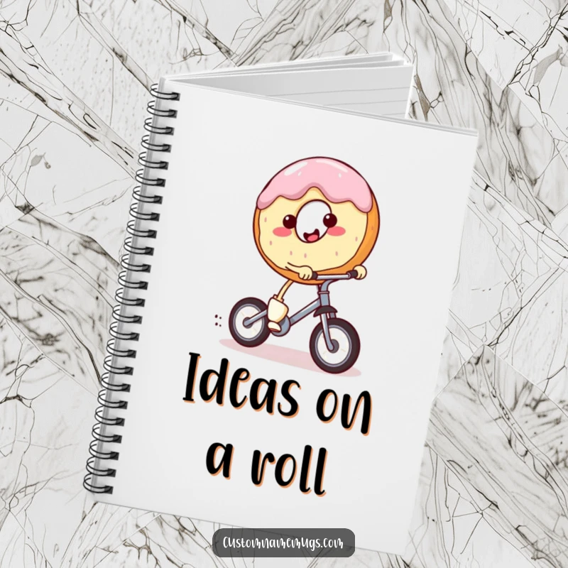 Funny notebook with a smiling, round donut character with tiny legs riding a miniature unicycle. Ideal for journaling and notes.