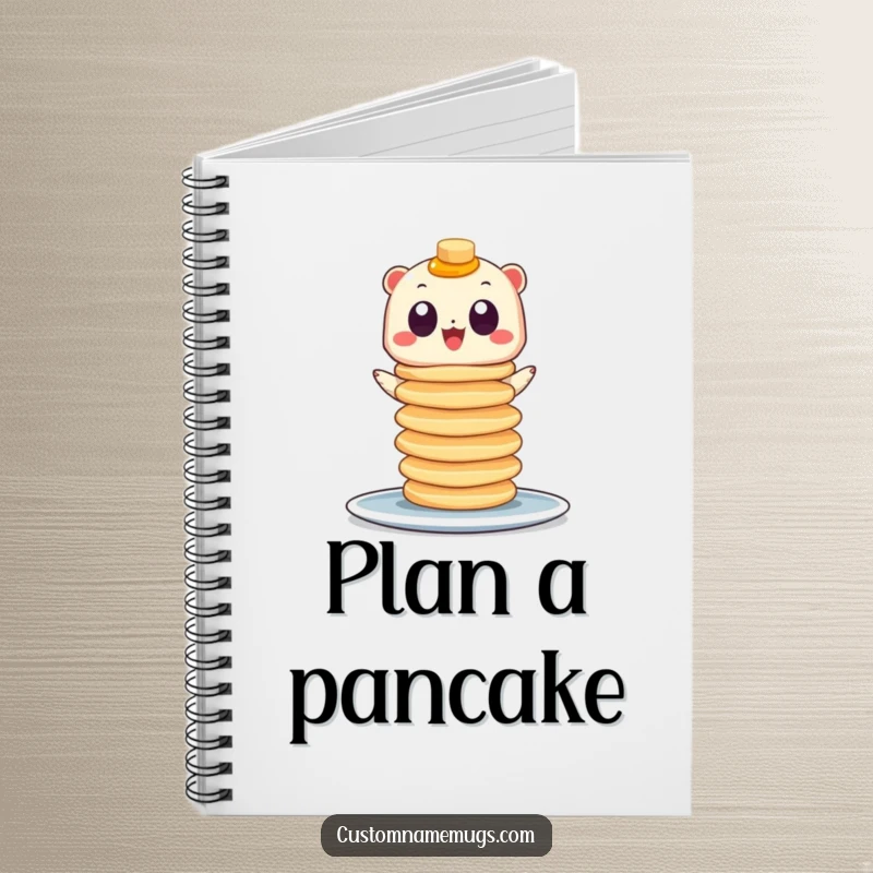 Funny notebook cover featuring a googly-eyed creature precariously balancing a tower of pancakes, encouraging sweet and silly note-taking.