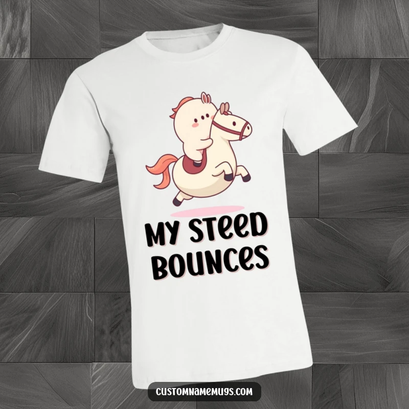 Funny t-shirt depicting a small blob character energetically trying to ride a giant bouncy ball like a steed, celebrating active fun.