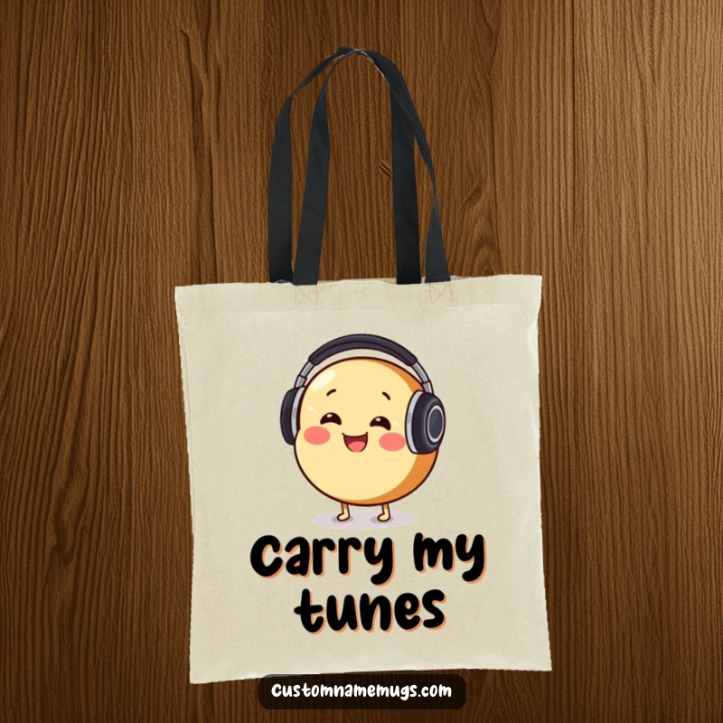 Funny Tote Bag: Smiling round bread character comically wearing oversized headphones, energetically bobbing its head to tunes.